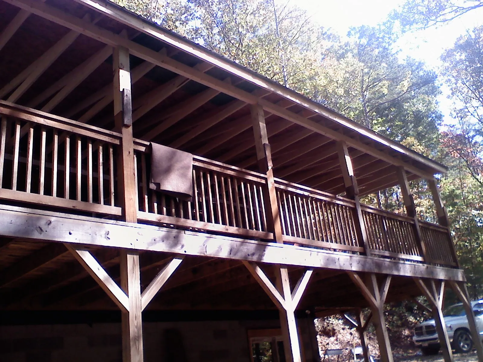 Timber framing under a new elevated porch and deck — Roof Leak Repair in Danese by Roofing Brothers